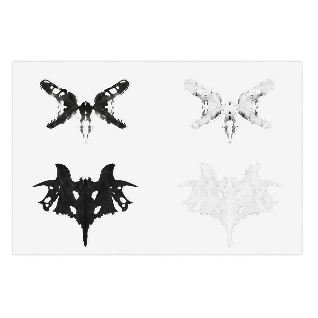 Black and white Rorschach style stickers against a white background