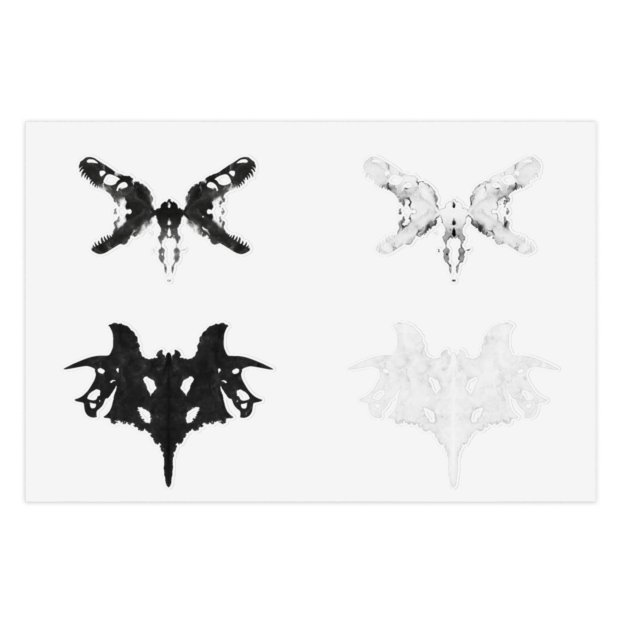 Black and white Rorschach style stickers against a white background